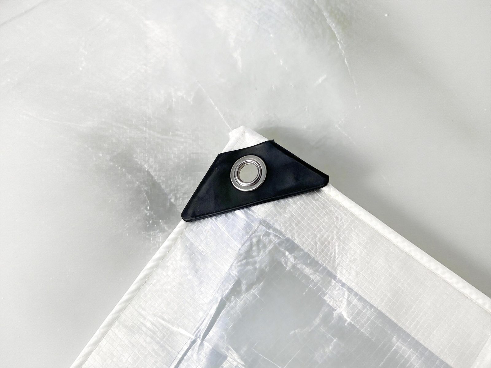 Reinforced eyelet corner detail for cherry rain cover tarpaulin
