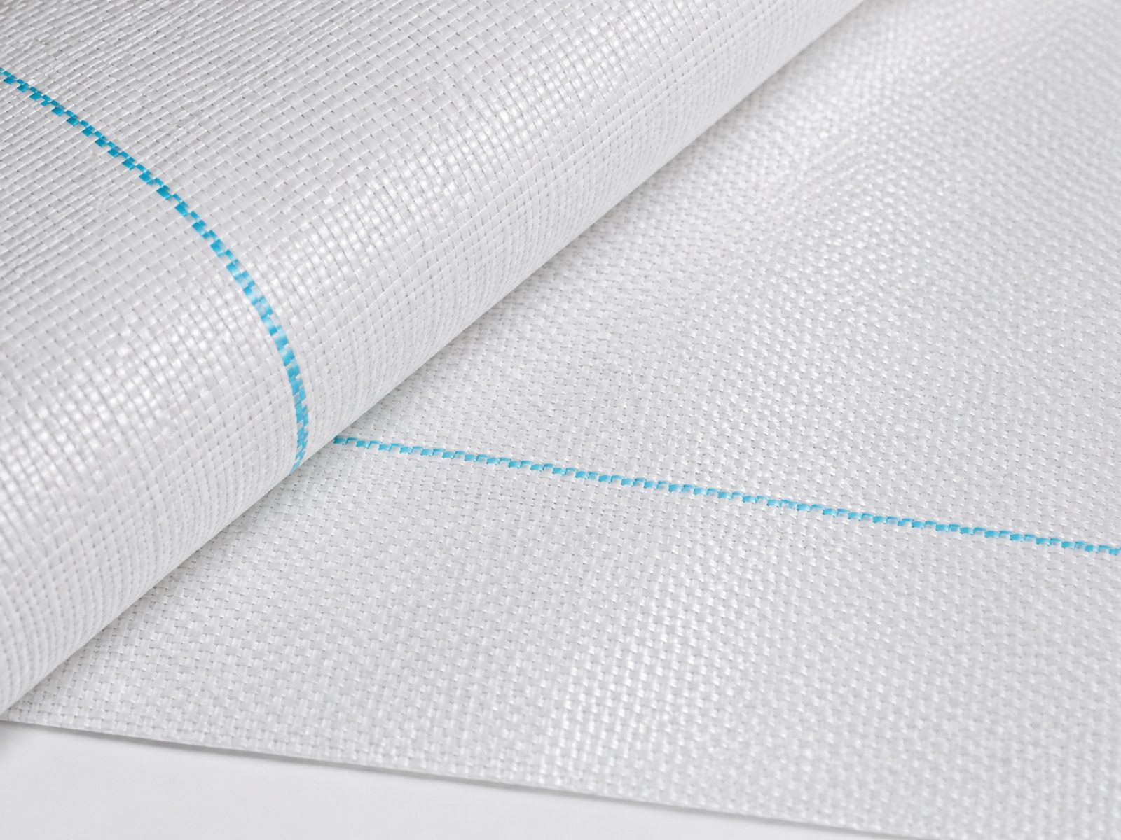 Close detail of durable woven white reflective PE ground cover